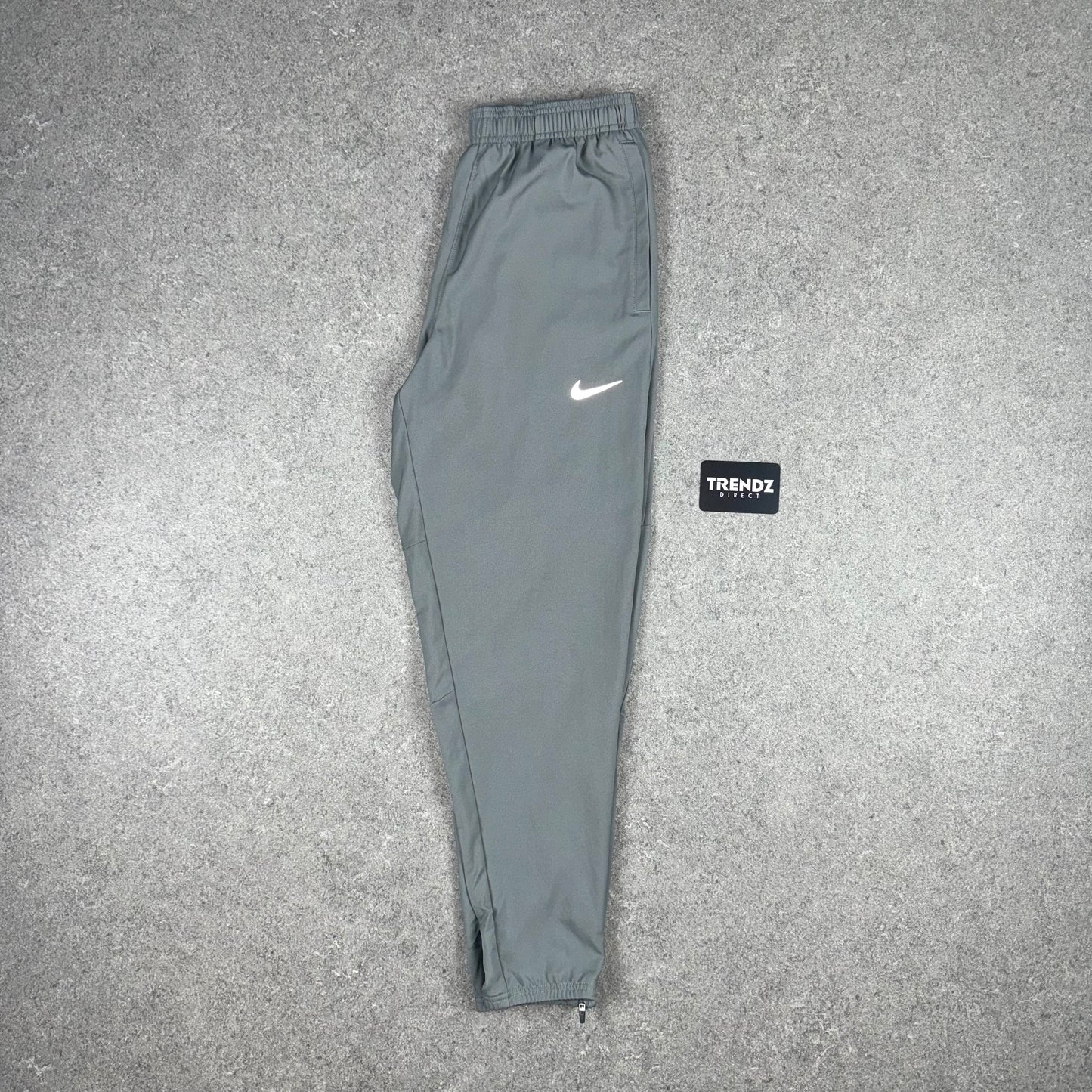NIKE DRI-FIT CHALLENGER PANTS - GREY