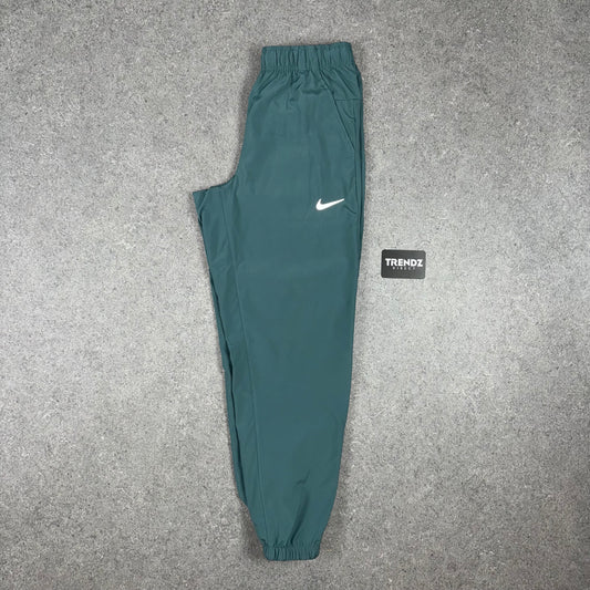 NIKE DRI-FIT CHALLENGER PANTS - JUNGLE GREEN